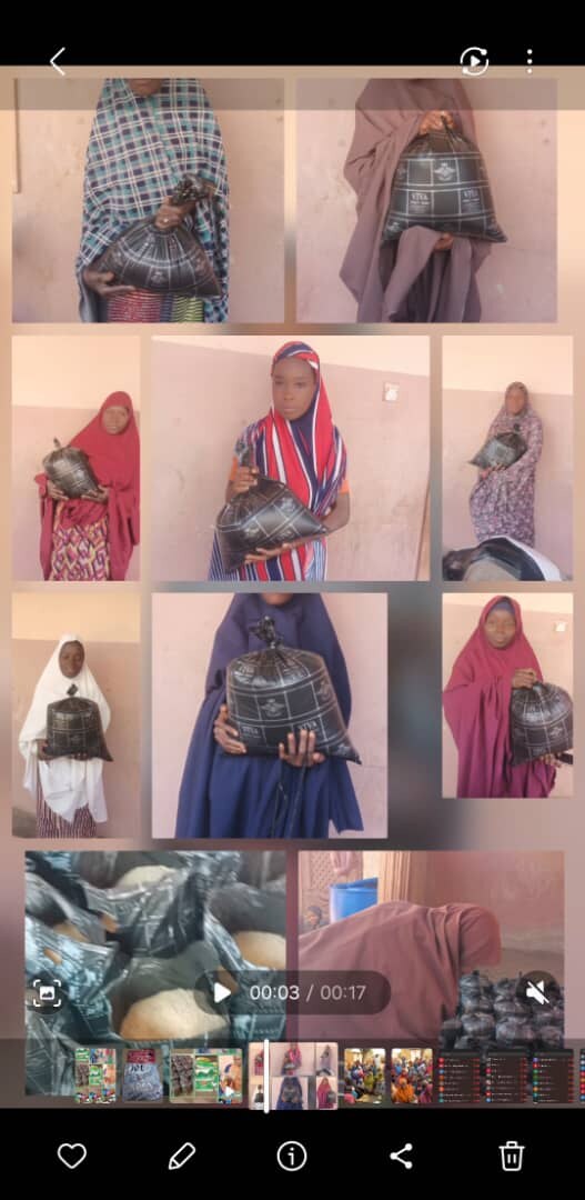 Women and families pictured with relief packages from an Usmaniyya Academy outreach